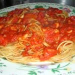 Quick and easy Garlic Tomato Marinara sauce loaded with freshly chopped garlic, onions, and parsley. It's perfect over pasta or as a pizza sauce.