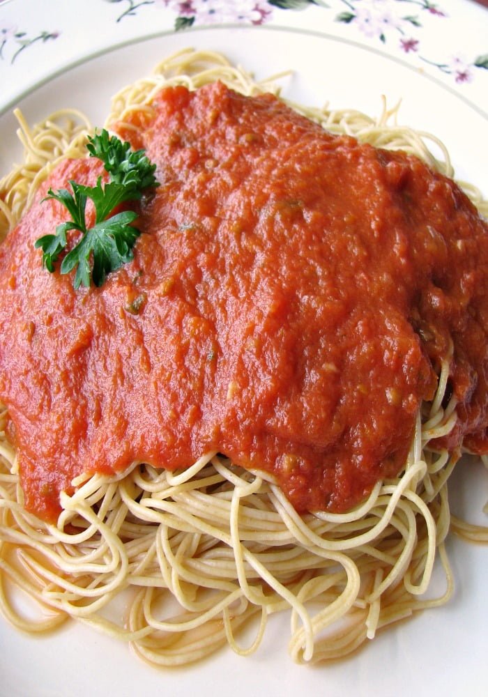 photo of a plate of spaghetti topped with Slow Cooker Marinara Sauce
