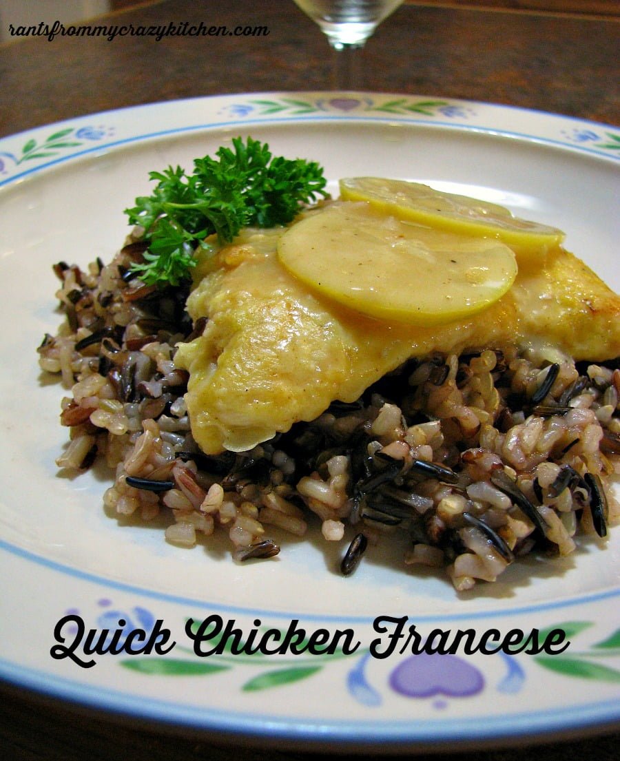 photo of a plate of chicken francese over a bed of wild rice