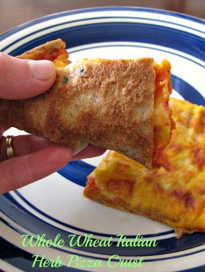 Whole Wheat Pizza Dough made with Italian herbs and seasonings. Healthy doesn't have to mean bland with this quick and easy recipe!