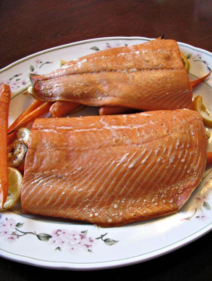 Grilled Cedar Plank Salmon- Simple plank salmon with carrots, garlic, and lemon. Great for summertime grilling!