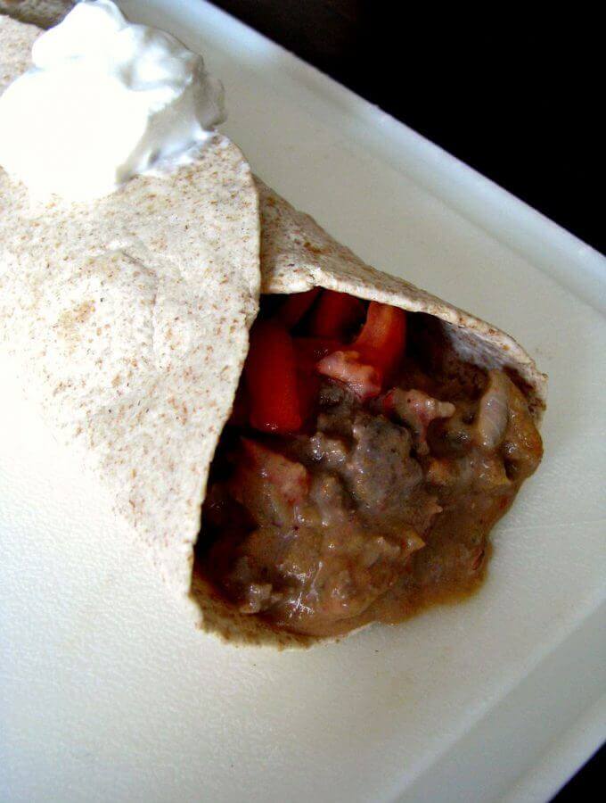 Cheesy ground beef in a Mexican inspired sauce wrapped in a soft flour tortilla, this Beef Meximelt is easy to make at home, and healthier than fast food!