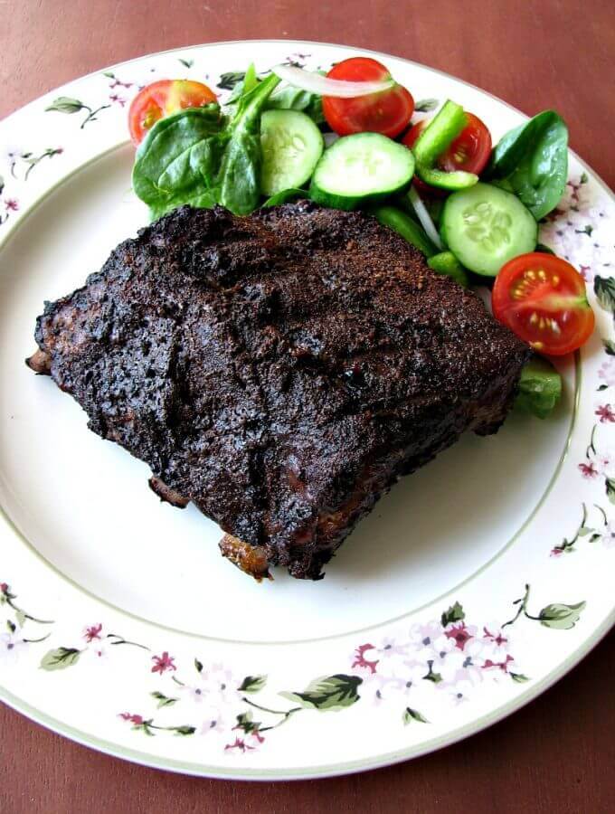 Mocha Rubbed Grilled Pork Ribs- first simmered in coffee, then rubbed with cocoa, coffee, brown sugar, garlic, and onion before grilling. These ribs are full of flavor, easy to make, tender, and great for a special occasion or anytime!