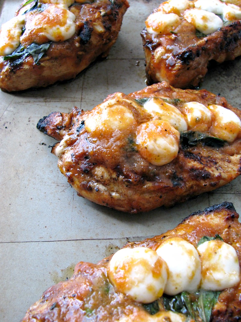 Grilled Sweet Caprese Chicken is made with chicken breasts marinated in a sweet cherry tomato sauce, grilled and topped with basil and mozzarella cheese.