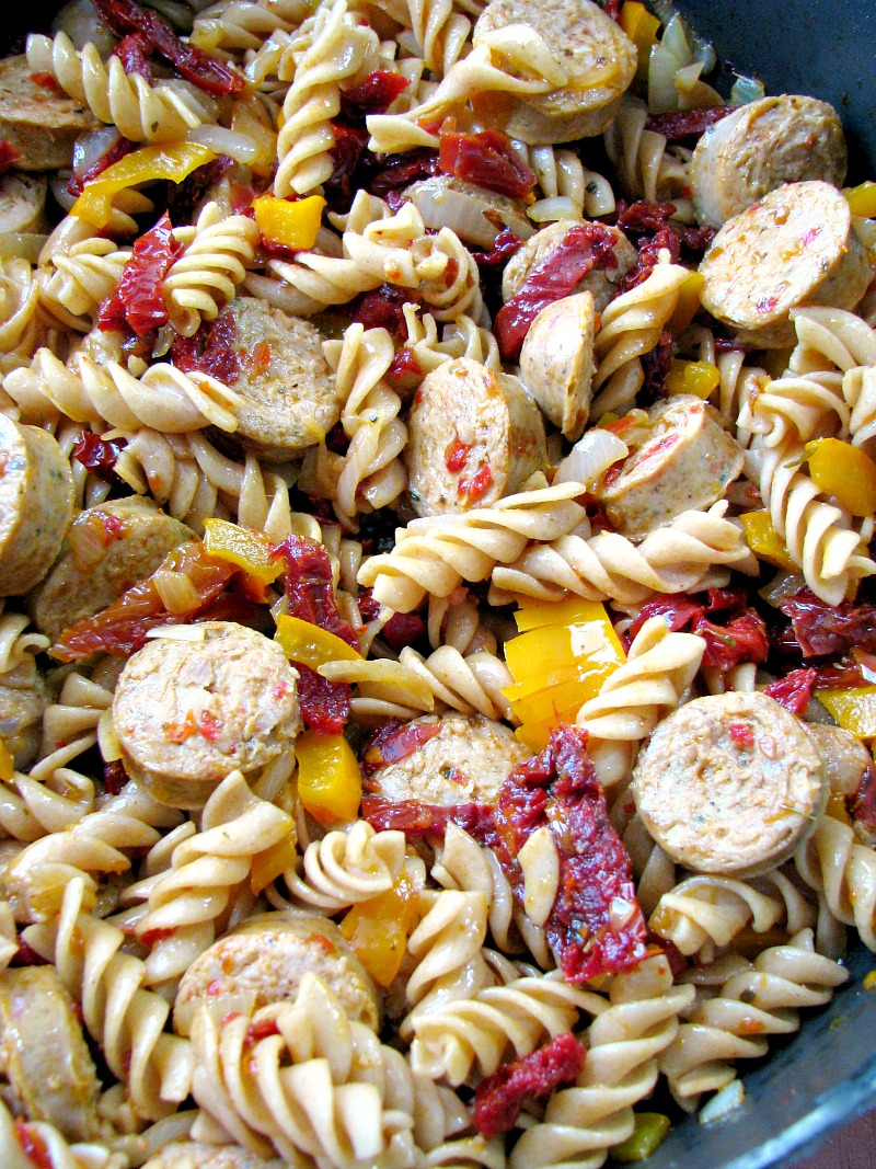 Quick and easy One Pot Chicken Sausage Pasta made with precooked chicken sausage, bell peppers, onions, and sun dried tomatoes makes a great weeknight summertime dinner. 