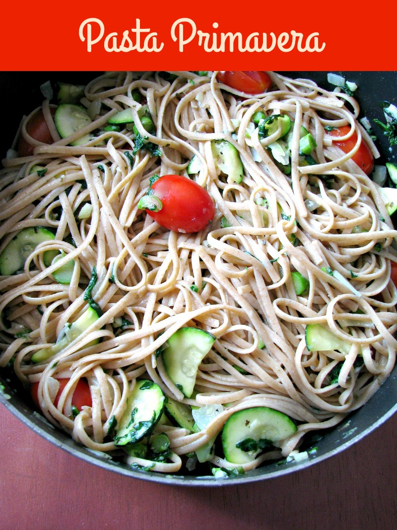 Light summertime vegetable Pasta Primavera, made with zucchini, spinach, asparagus, tomatoes, onions, and garlic, is a quick and easy dinner ready in less than 30 minutes.
