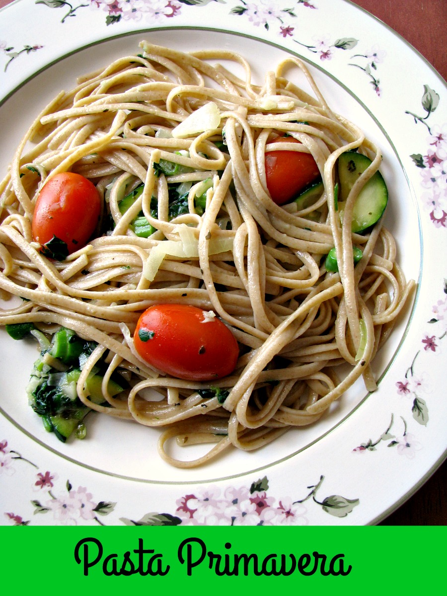 Light summertime vegetable Pasta Primavera, made with zucchini, spinach, asparagus, tomatoes, onions, and garlic, is a quick and easy dinner ready in less than 30 minutes.