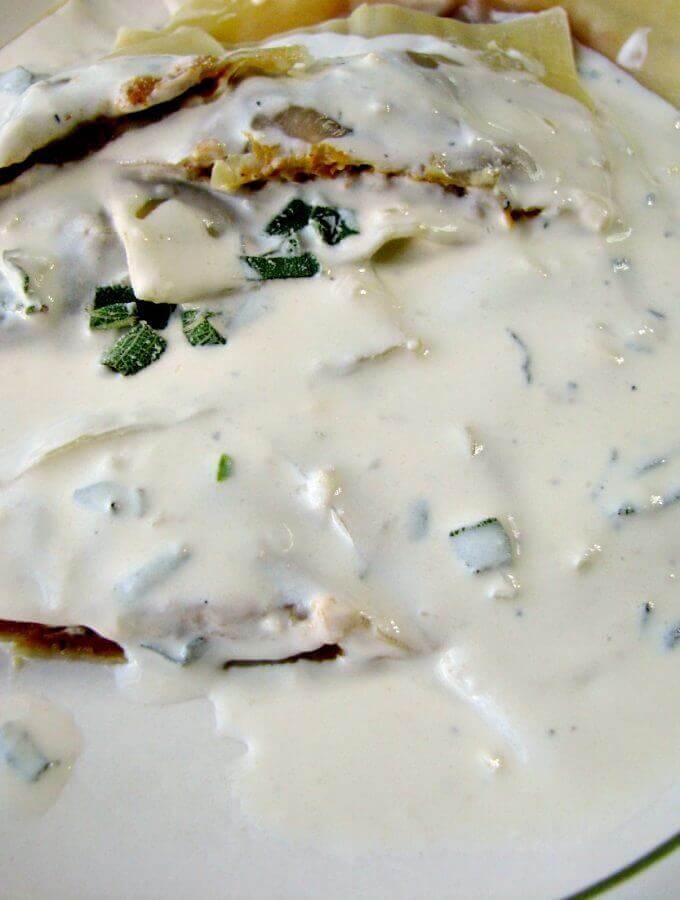 Homemade Pumpkin Ravioli with Parmesan Sage Cream Sauce is a restaurant quality main dish made easy with canned pumpkin puree and wonton wrappers. They taste like pumpkin pie filled pasta! 
