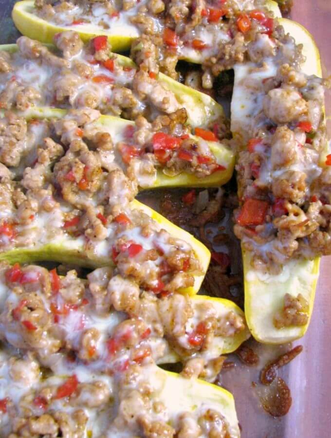 Baked ground Chicken Fajita Stuffed Summer Squash in baking pan overhead photo.