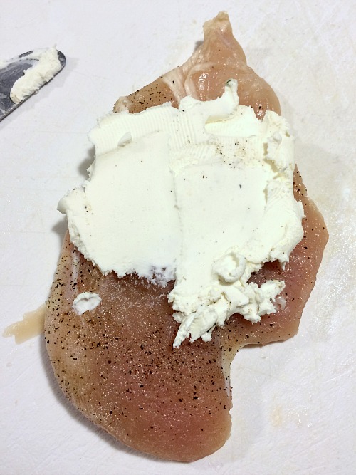 Photo of cream cheese on a chicken breast
