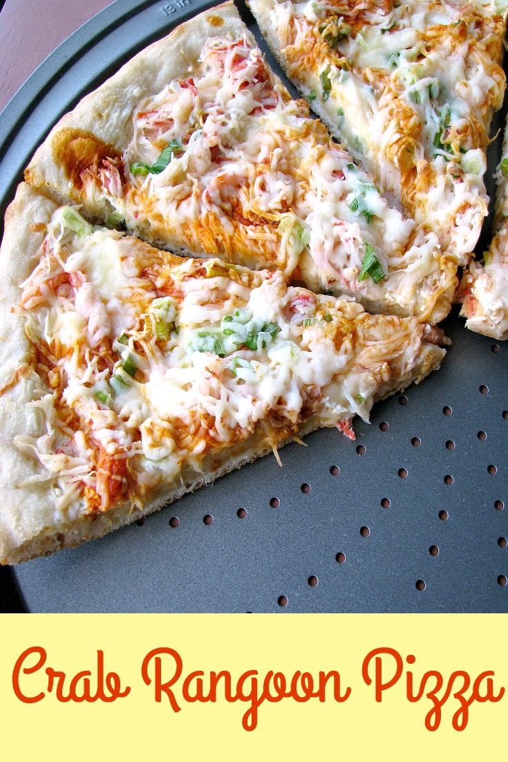 Photo of baked Homemade Crab Rangoon Pizza on a round pizza pan with the lower slices removed
