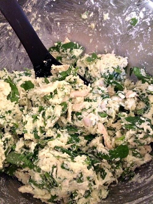 Photo of mixed chicken spinach and ricotta in a metal bowl.