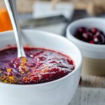 photo of a white bowl full of cranberry sauce